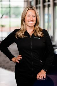 Dr. Kelli Thiele headshot wearing black attire